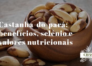 benefícios da castanha-do-pará — castanhas grandes triangulares com casca escura sobre fundo de madeira